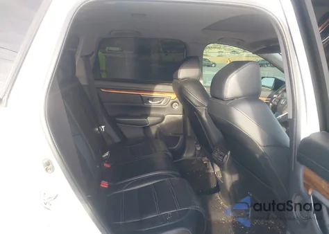 2019 Honda Cr-V Touring z USA, uszkodzony, nr VIN 7FARW1H90KE003990